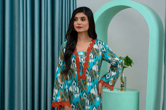 Model showcasing a vibrant 2-piece multi printed lawn suit, featuring colorful patterns and elegant detailing.