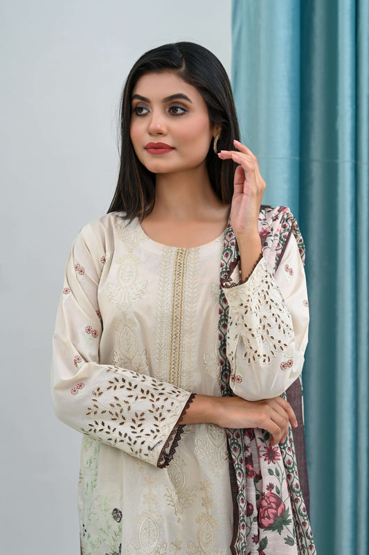 Elegant model wearing a 3-piece skin embroidered lawn suit, showcasing delicate embroidery and feminine silhouette.