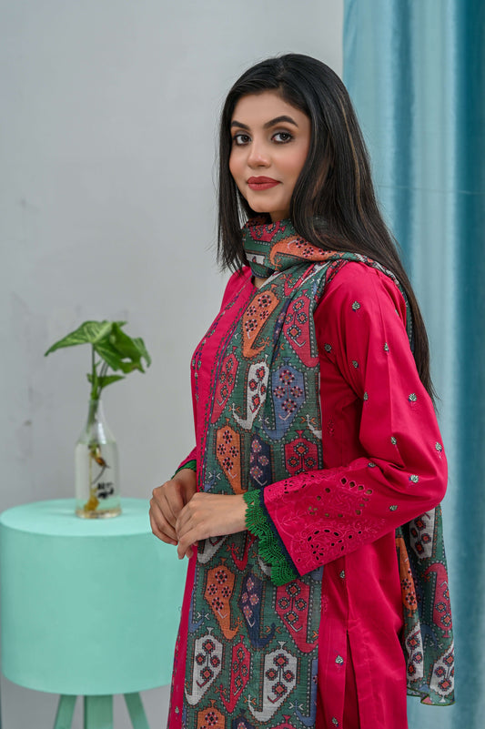 Model wearing a pink embroidered lawn suit with a colorful dupatta, showcasing elegant fashion.