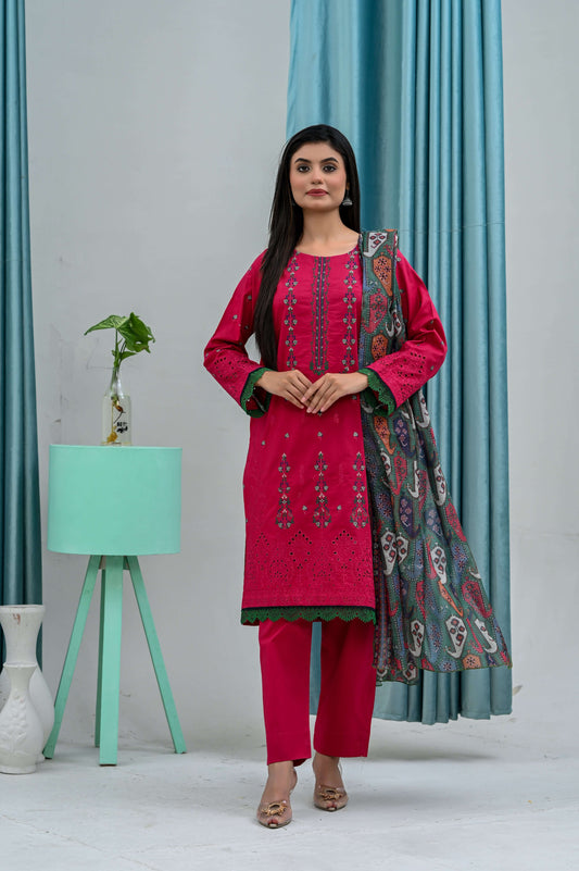 Model wearing a pink embroidered lawn suit paired with a patterned dupatta against a stylish backdrop.