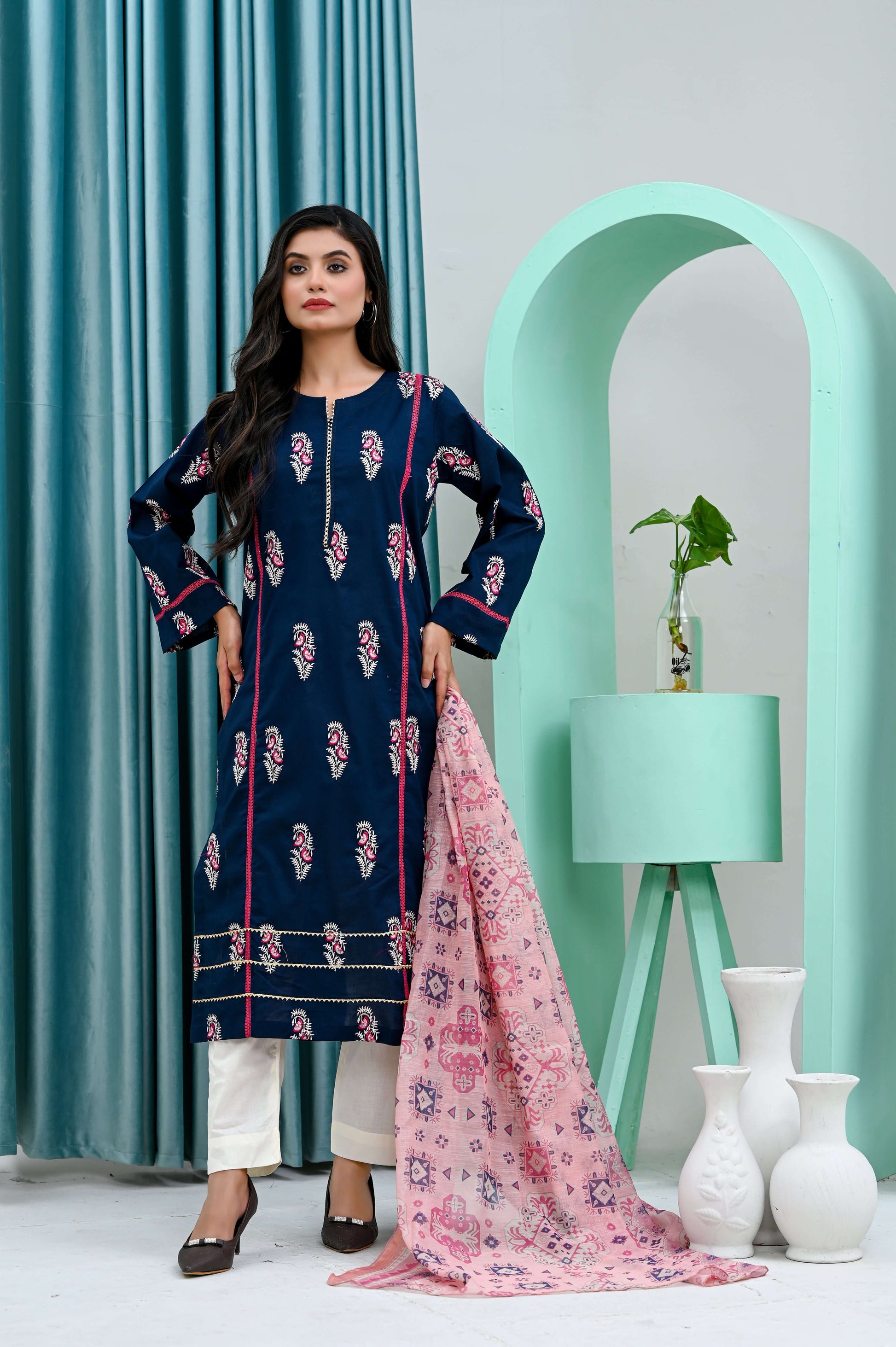 Elegant navy blue shirt with floral design, paired with a pink dupatta, showcasing stylish everyday wear.